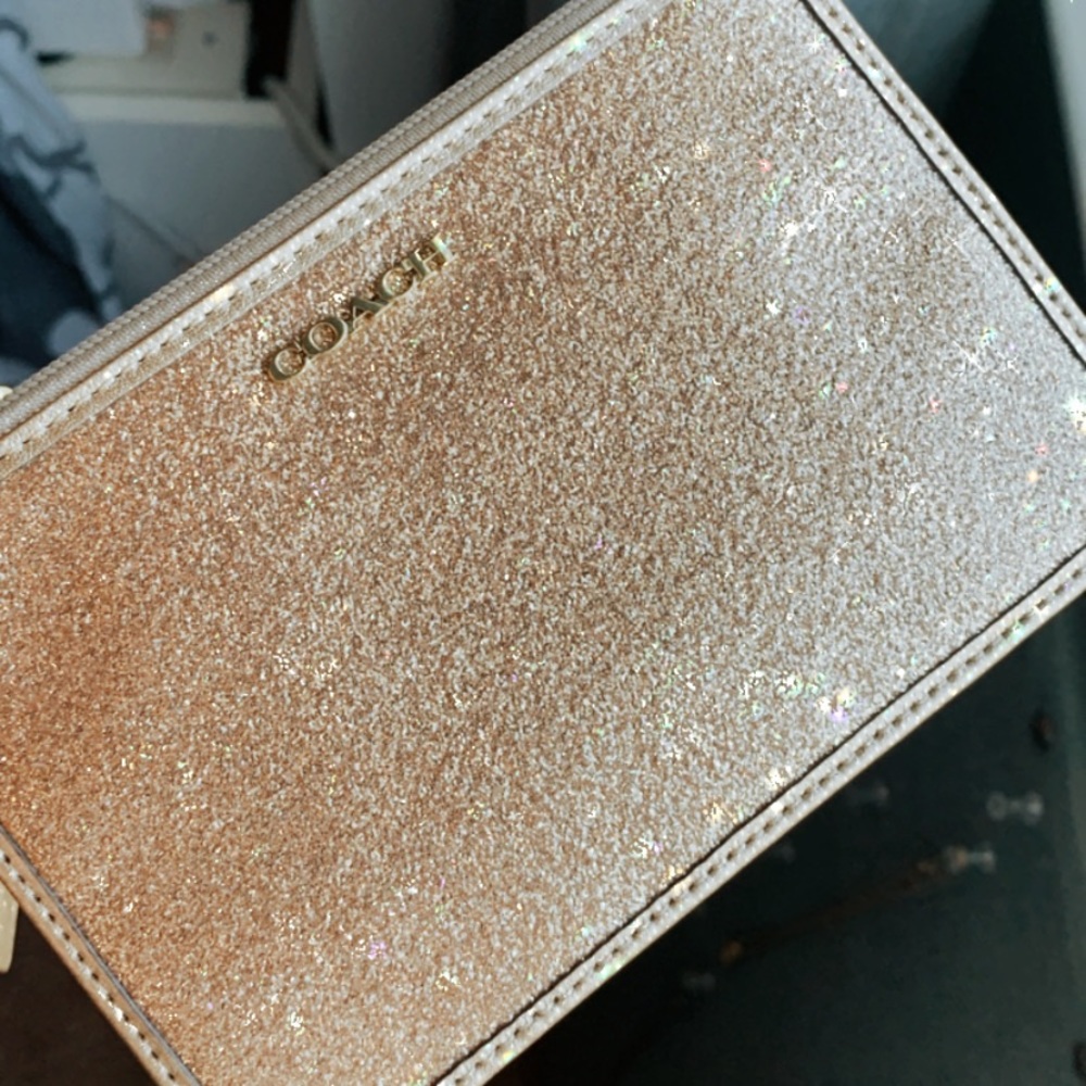 Gold sparkly Coach Wristlet